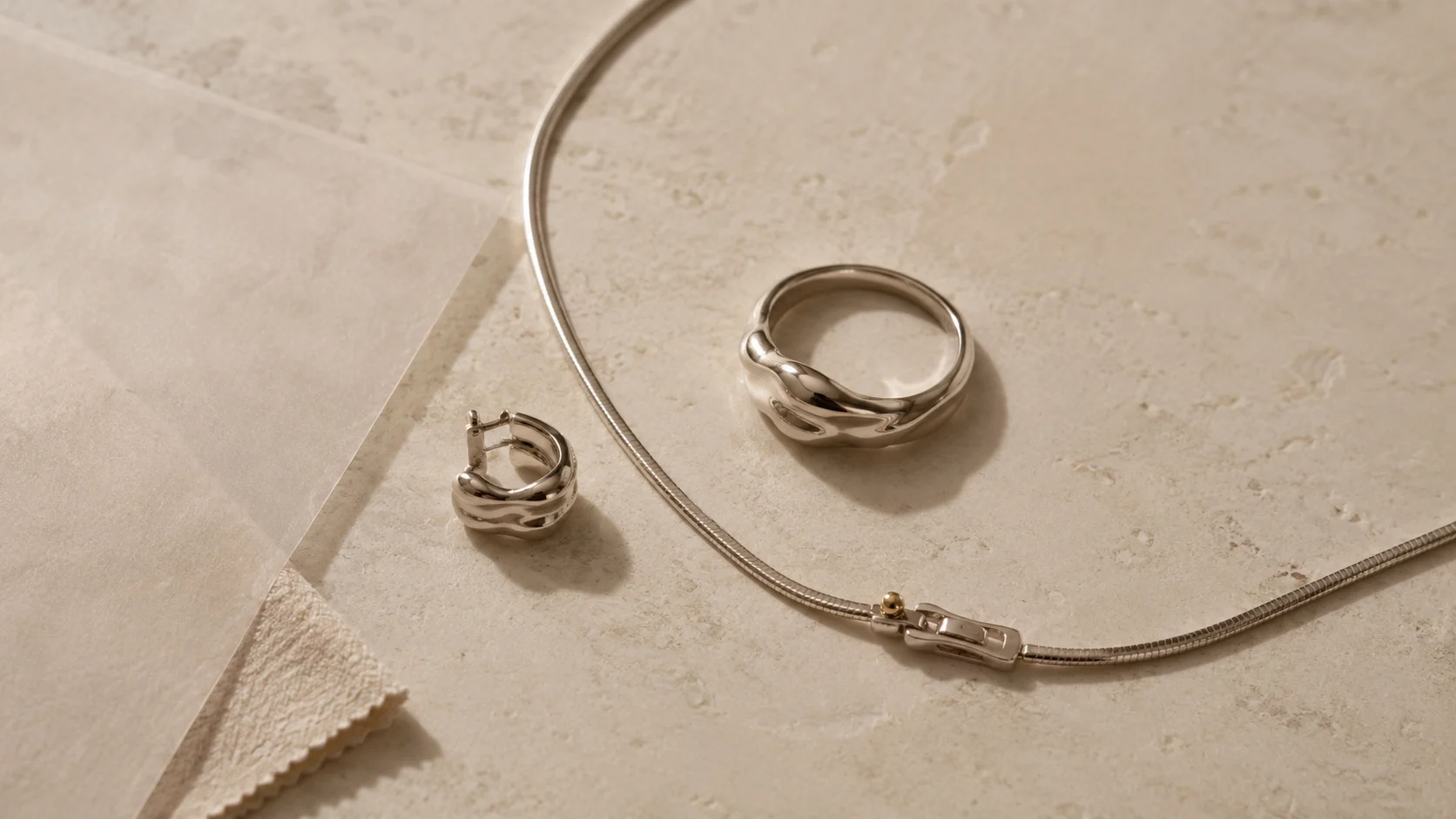 A jewelry composition arranged to compare scale, spacing and visual roles