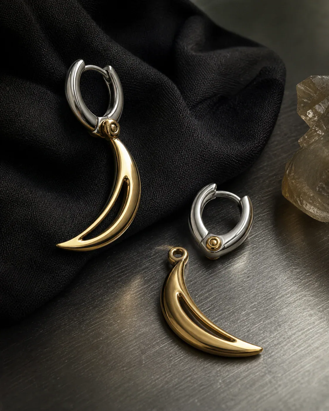 AI-assisted Switchroom design study showing a contrasting metal-tone huggie earring with a removable crescent drop, not a photographed product
