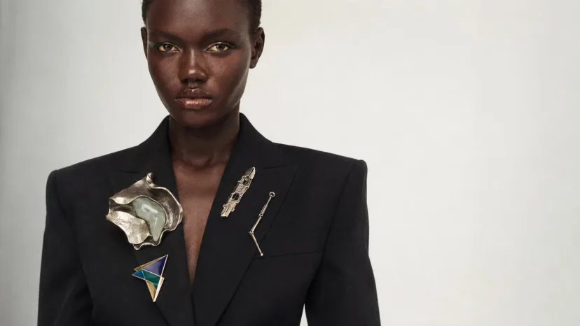 merch culture semiotics — a model wearing layered symbols that don’t agree