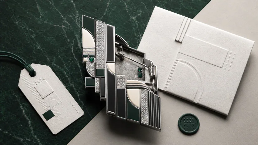 supply chain and symbolic meaning — a receipt, an origin label, and a sculptural brooch