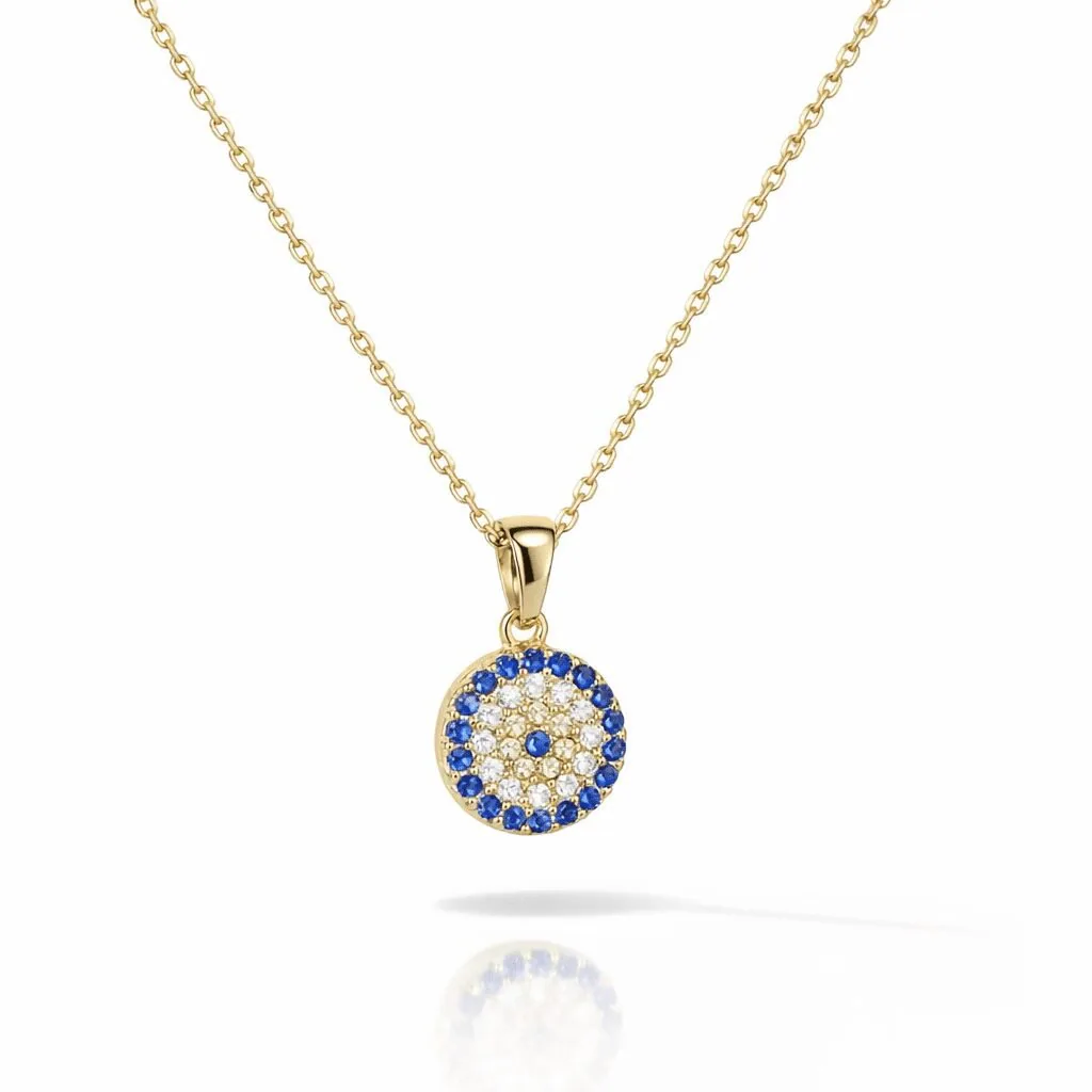 evil eye necklace in gold vermeil modern round pendant with blue halo stones and clear crystal accents