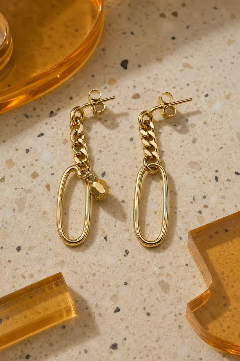Adult model wearing articulated sculptural earrings with linked modular segments
