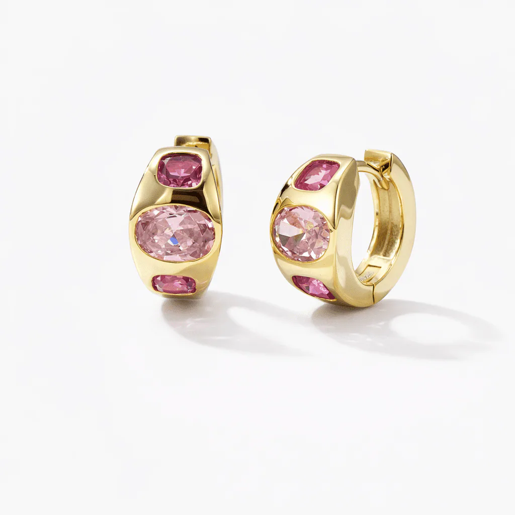 gold vermeil hoop earrings with three bezel-like pink accents on each rounded front face