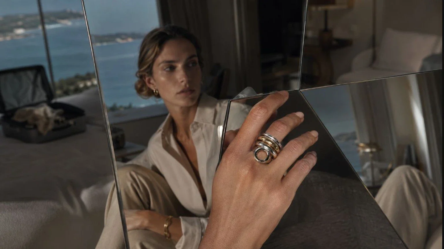 travel style psychology shown through a hotel drawer with nails, jewelry, and a cobalt Room Key object