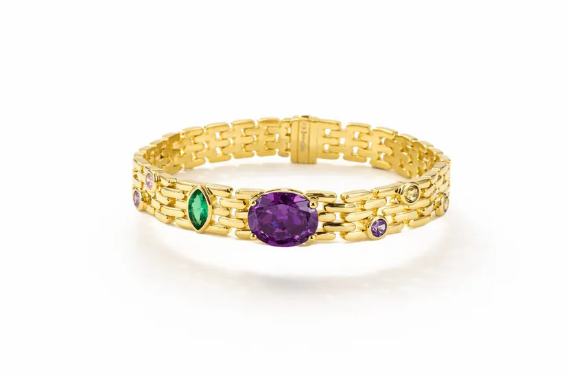 gold link bracelet in 18k gold vermeil with multicolor gemstone bezels, oval purple center stone and green marquise accent