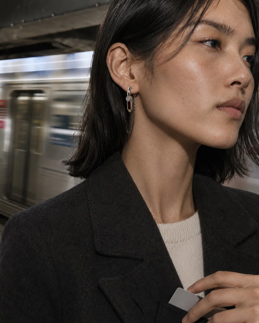 Adult wearer styling a convertible ear module in a compact everyday configuration