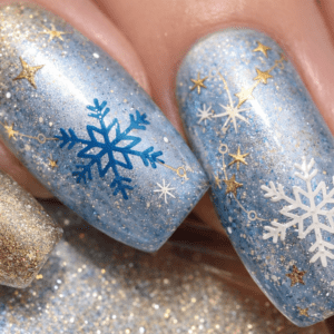 Sparkly winter nails with metallic gold accents and frosty blue base, perfect for New Year’s Eve parties and festive gatherings.
