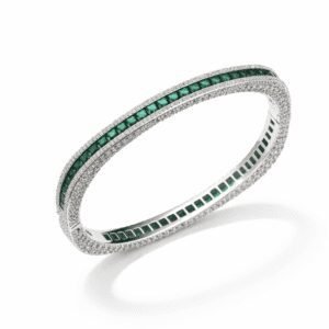 Silver bangle bracelet with green stones in silver-tone modern design with pavé borders and channel-set green stones