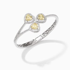 silver bangle bracelet in polished silver with three citrine heart stones, pavé halo accents, hinged clasp design