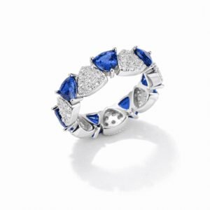 silver sapphire eternity ring in sterling silver with alternating heart-cut blue and clear stones, sculptural prong setting